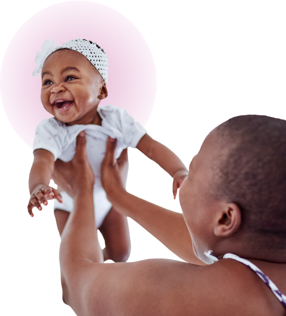 mother holding a baby up in the air with a big smile