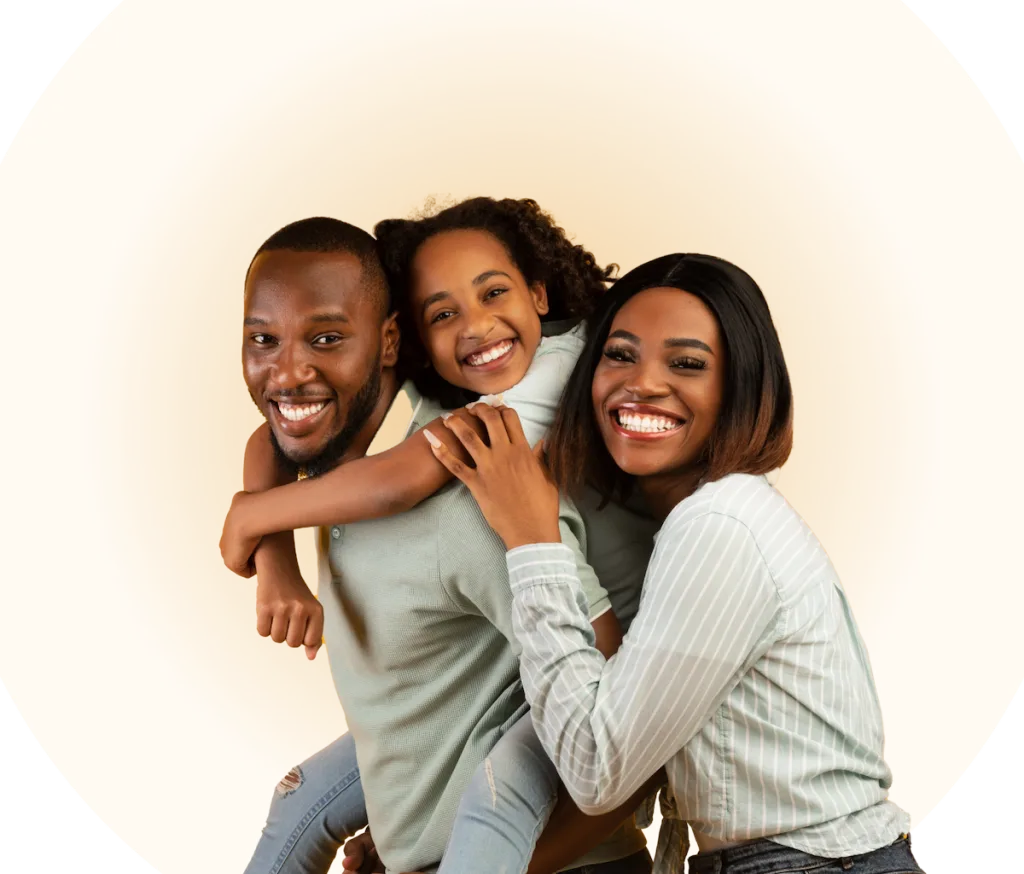 mother and father smiling with daughter hugging father around his neck