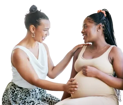 friend touching her pregnant friend's belly