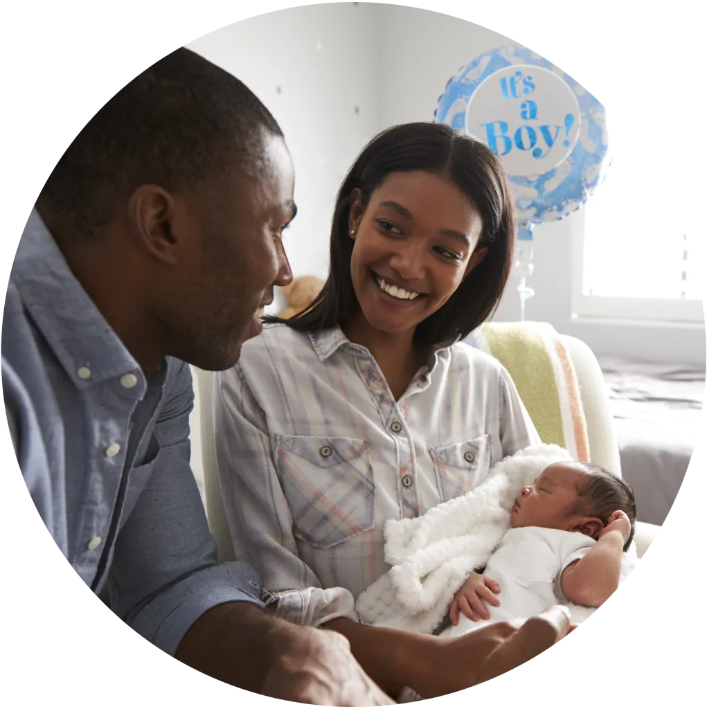 mother and father at home with newborn baby