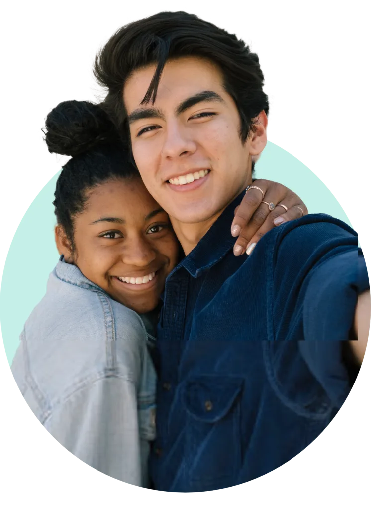 teen girlfriend and boyfriend smiling